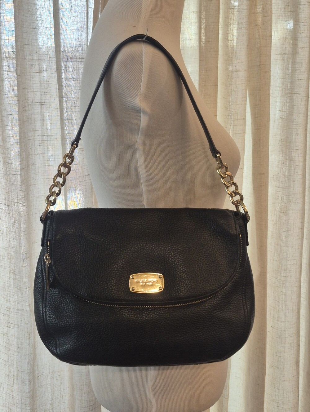 Michael Kors Black and Gold Crossbody Bag with Structured Design